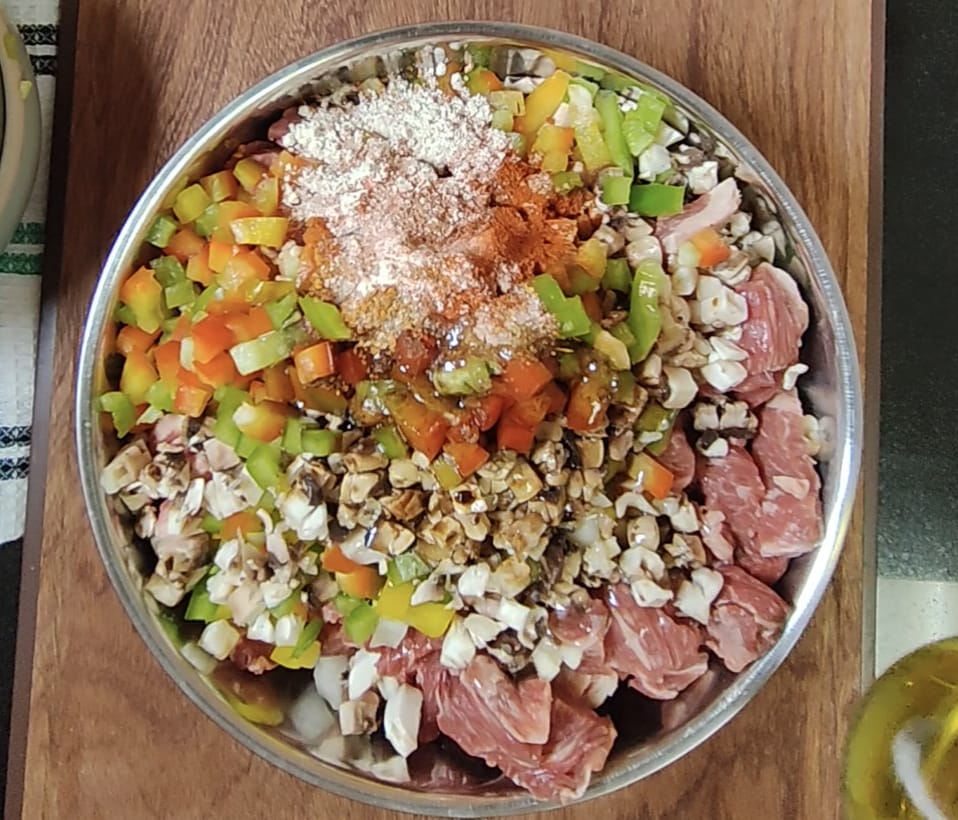 Chopped beef, bell peppers, mushrooms and seasonings prepared for air frying