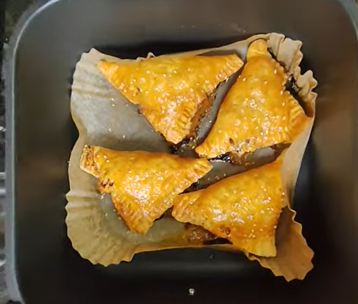 Beef and cheese puff pastry triangles cooked golden in the air fryer