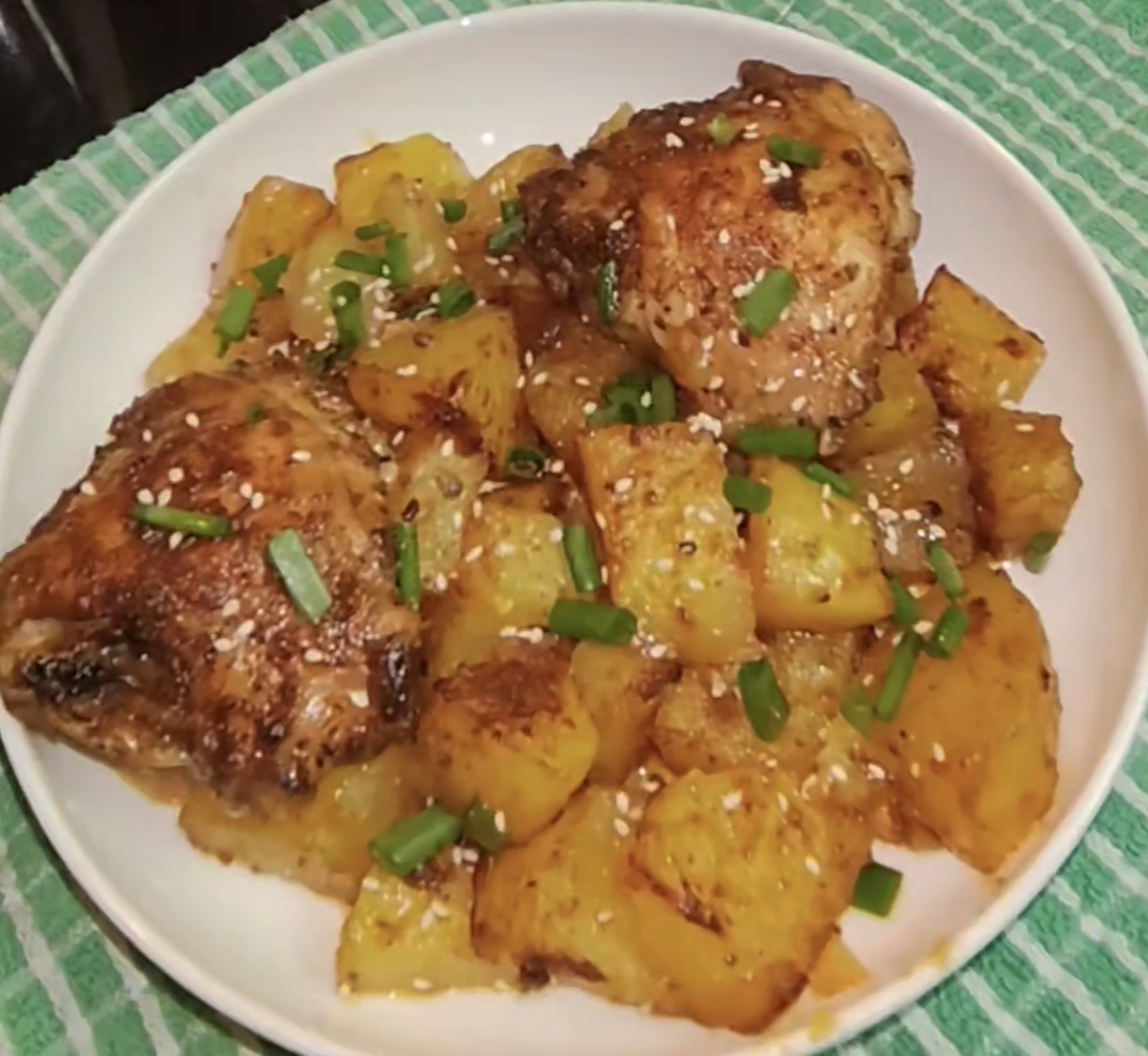 Air fryer chicken and potatoes cooked together, from Lackie Flavors.